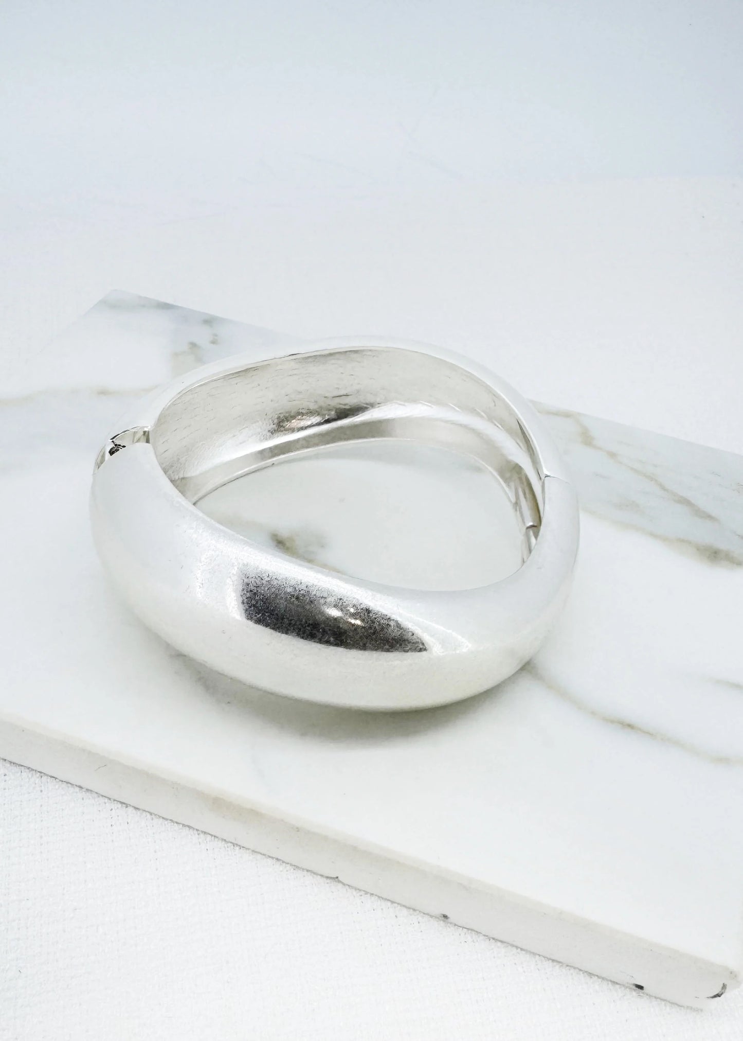 Envy Worn silver wide hinged bangle