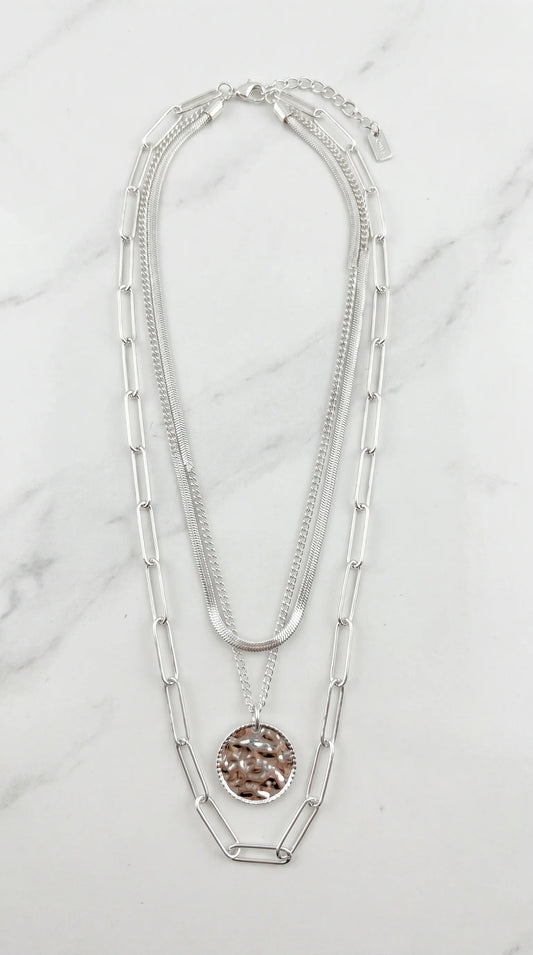 Envy Short silver triple layered necklace with a battered circle pendant