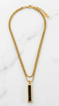 Envy Short gold double layered necklace with gold and black bar pendant