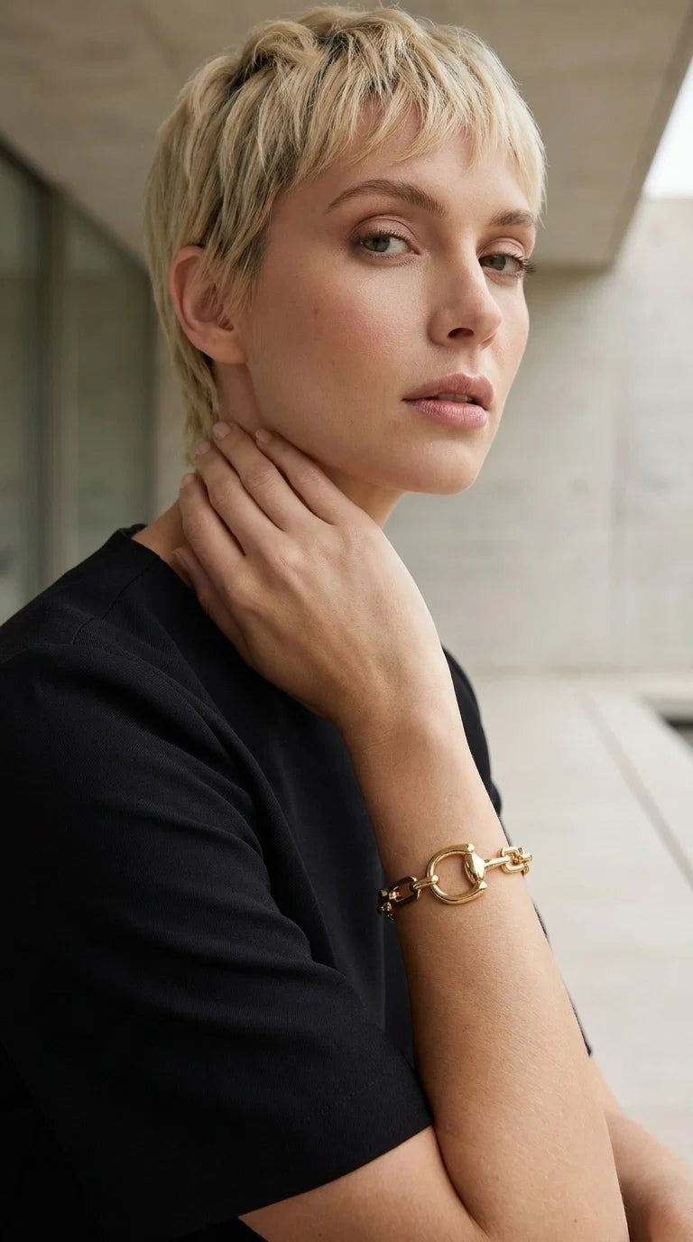 Envy Gold double layered linked chain bracelet with horsebit design
