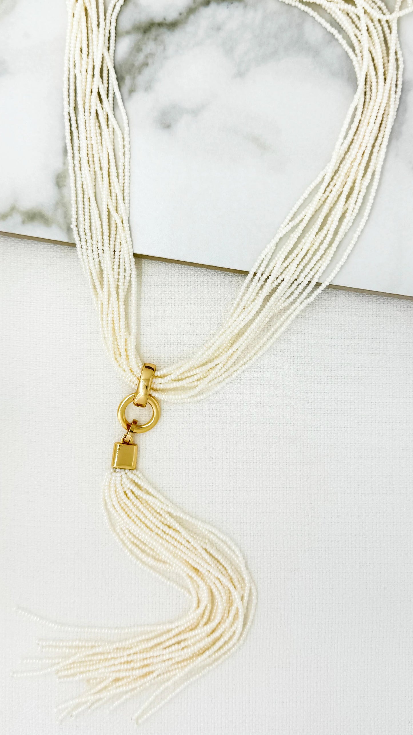 Envy Cream bugle tassel necklace with gold link